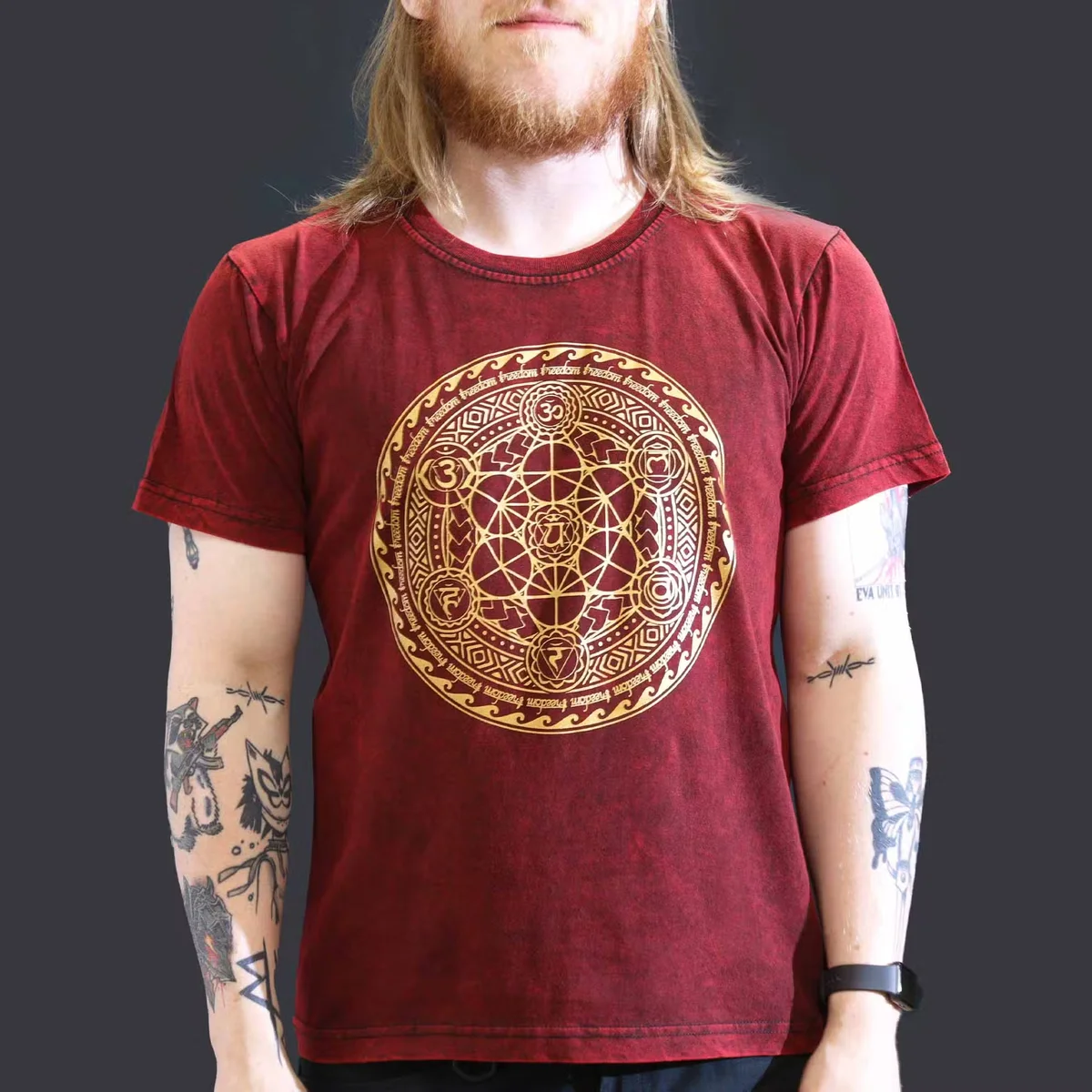 Maroon t-shirt with large stone washed effect and chakra design displayed on a plain background, image position 3