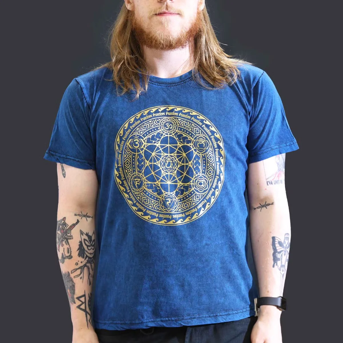 Blue large stone washed t-shirt featuring a chakra design, displayed flat against a white background
