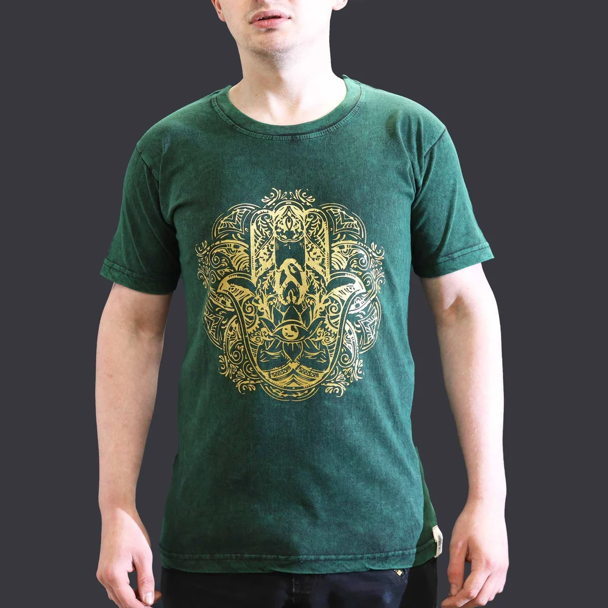 Green small stone washed t-shirt featuring a Hamsa hand graphic on the front