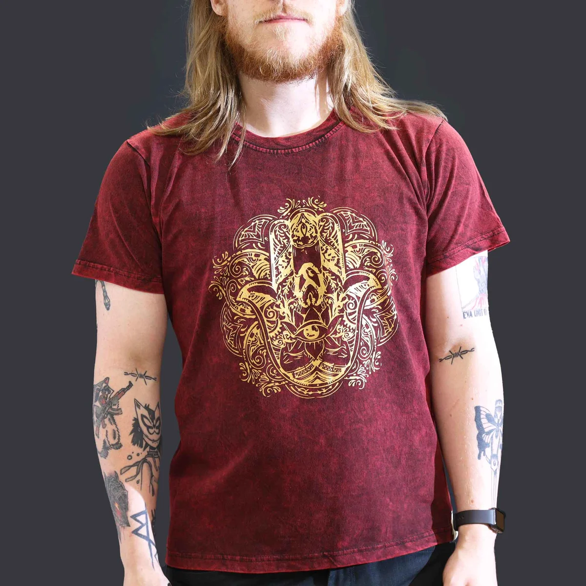 Maroon t-shirt with large stone washed fabric and Hamsa hand design on front, displayed on plain background