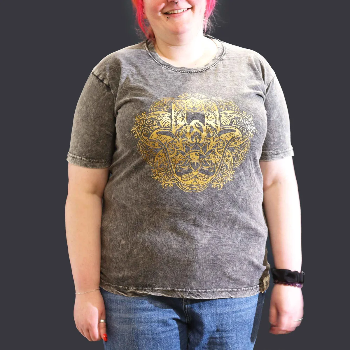 Dark grey t-shirt with stone washed texture and Hamsa hand graphic on front, laid flat on white background