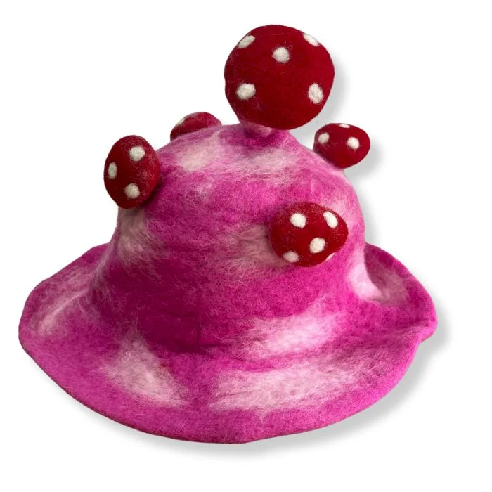 Shocking pink felted mushroom hat with a rounded cap and textured surface displayed on a white background