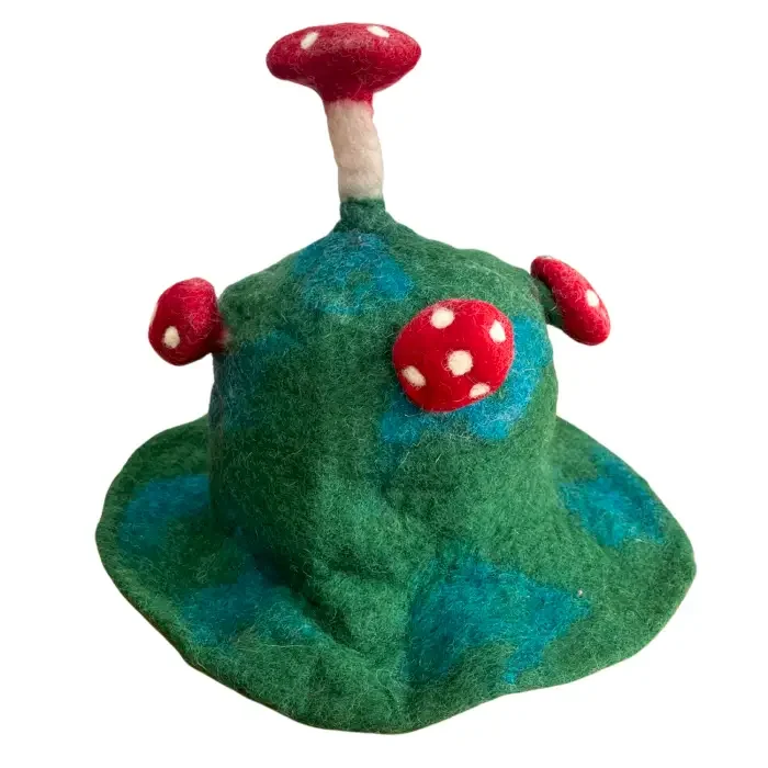 Moss green hat styled as a felted mushroom with rounded mushroom shape.