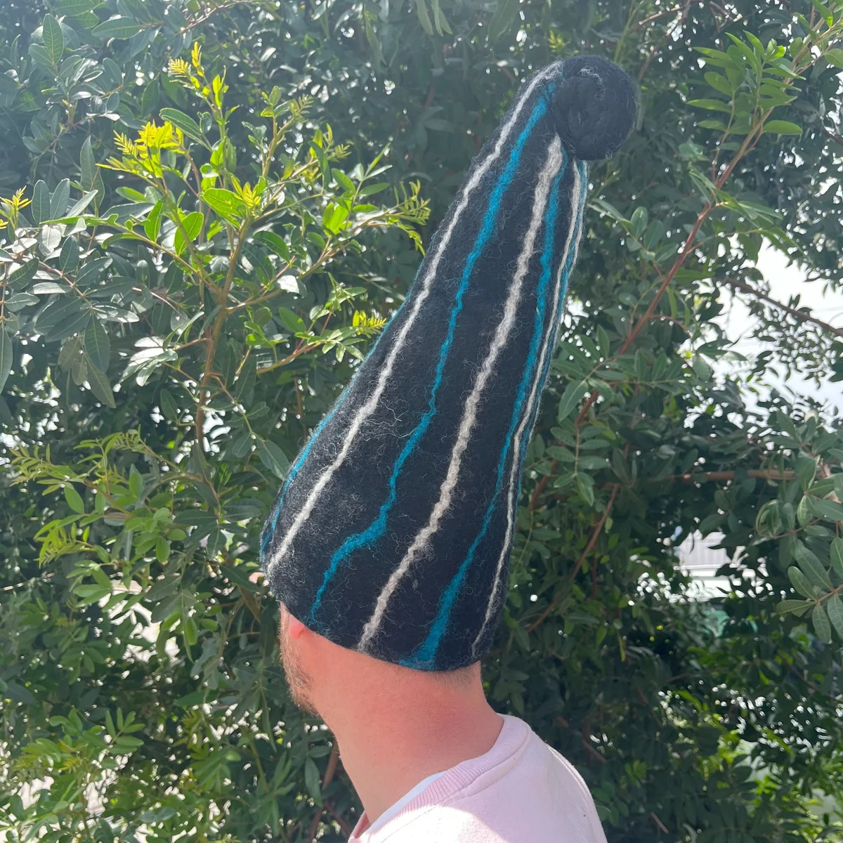 Felted sauna wizard hat in black with blue streaks – a black blue sauna hat