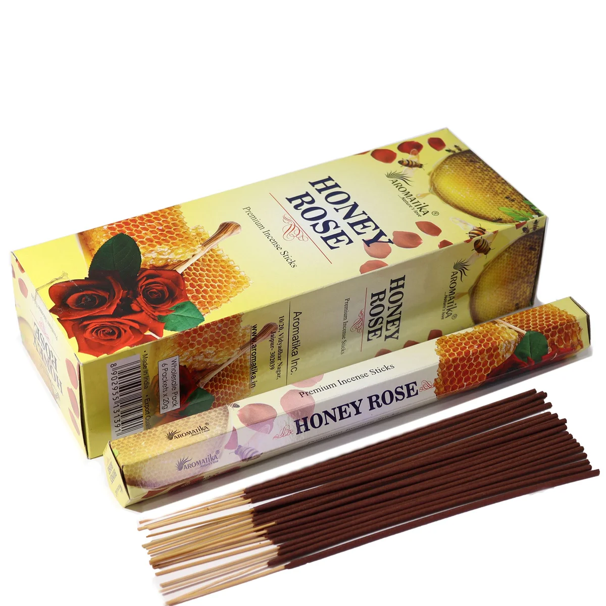 Hex-shaped Aromatika charcoal free incense sticks in Honey Rose scent with decorative packaging on white background