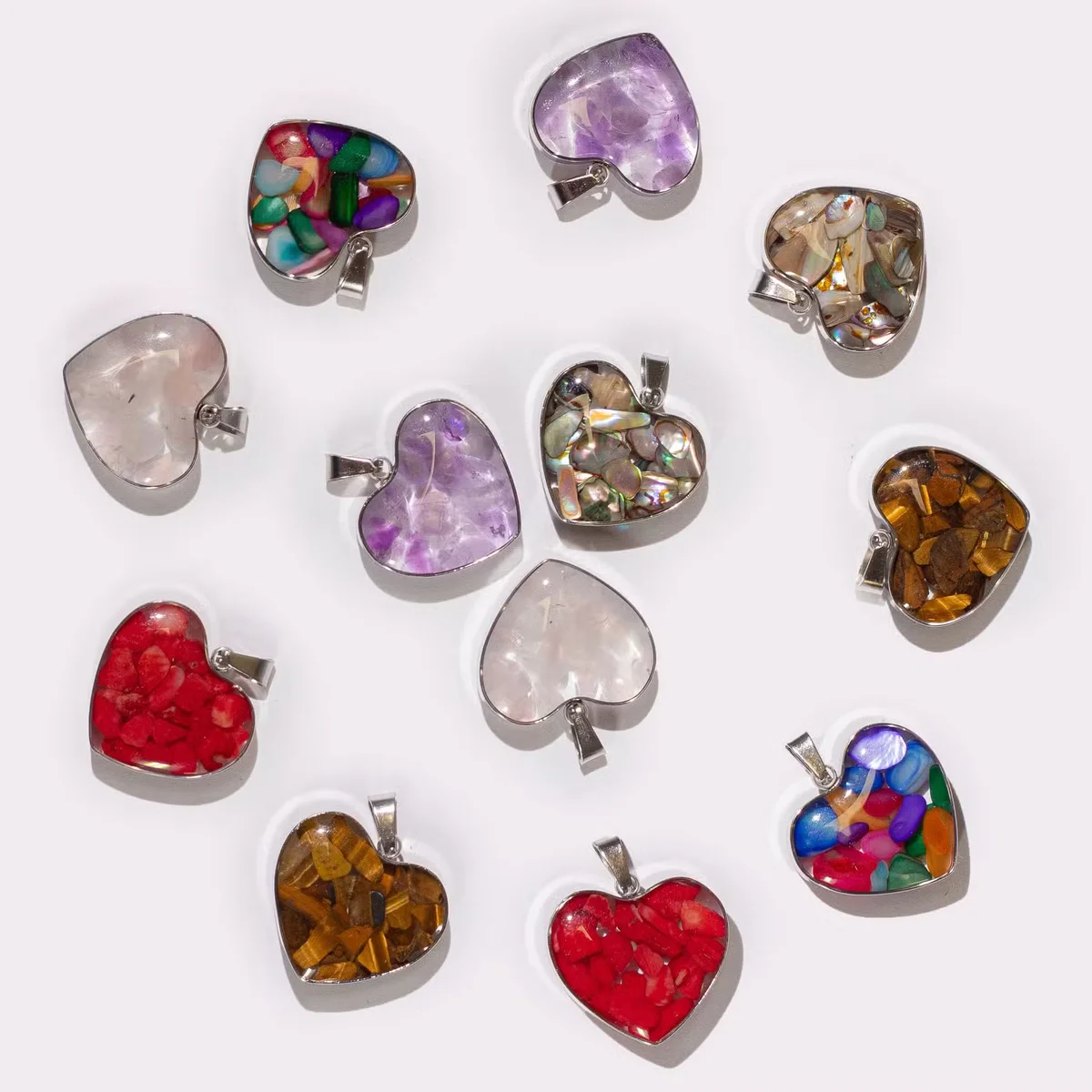 Heart-shaped pendant with steel case, featuring assorted gemstone chips and shells, ideal gemstone chip necklaces.