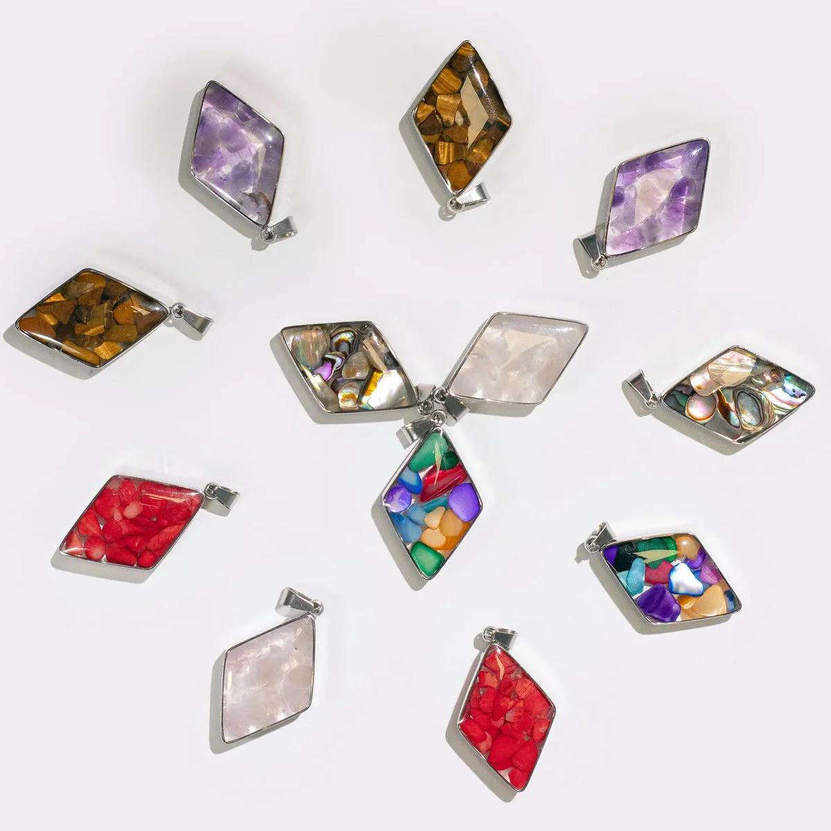 Steel case pendant featuring 12 assorted gemstone chips and shells