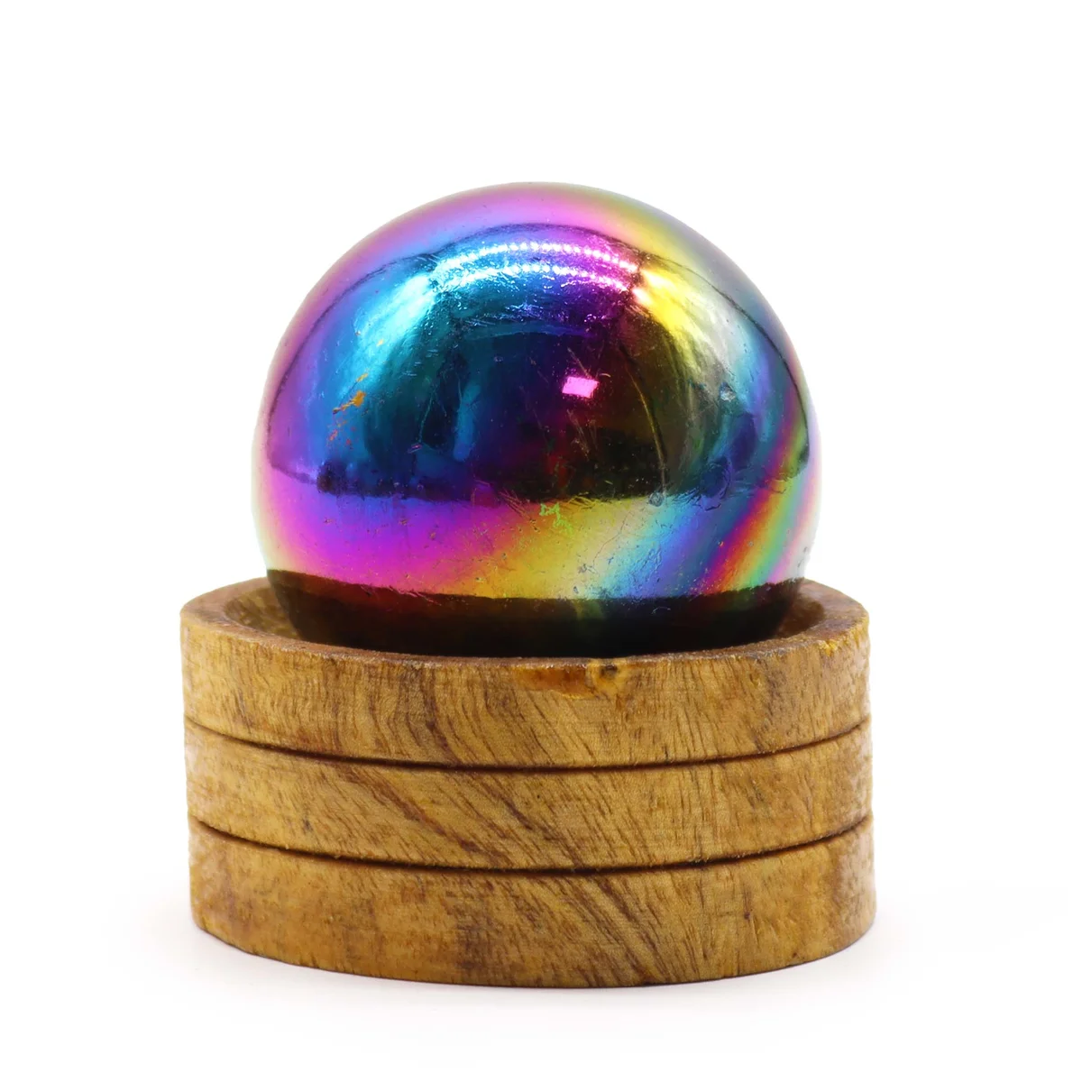 Stylish 50mm amethyst sphere sitting on a simple stand, surrounded by soft light, showing its translucent purple glow.