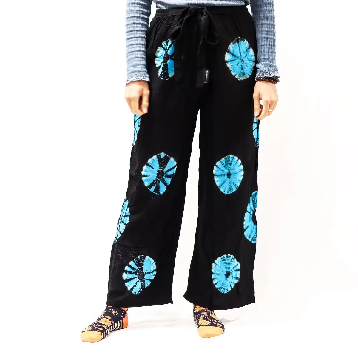 Black and blue Japanese style comfortable lounge trousers in medium size displayed flat on a white background