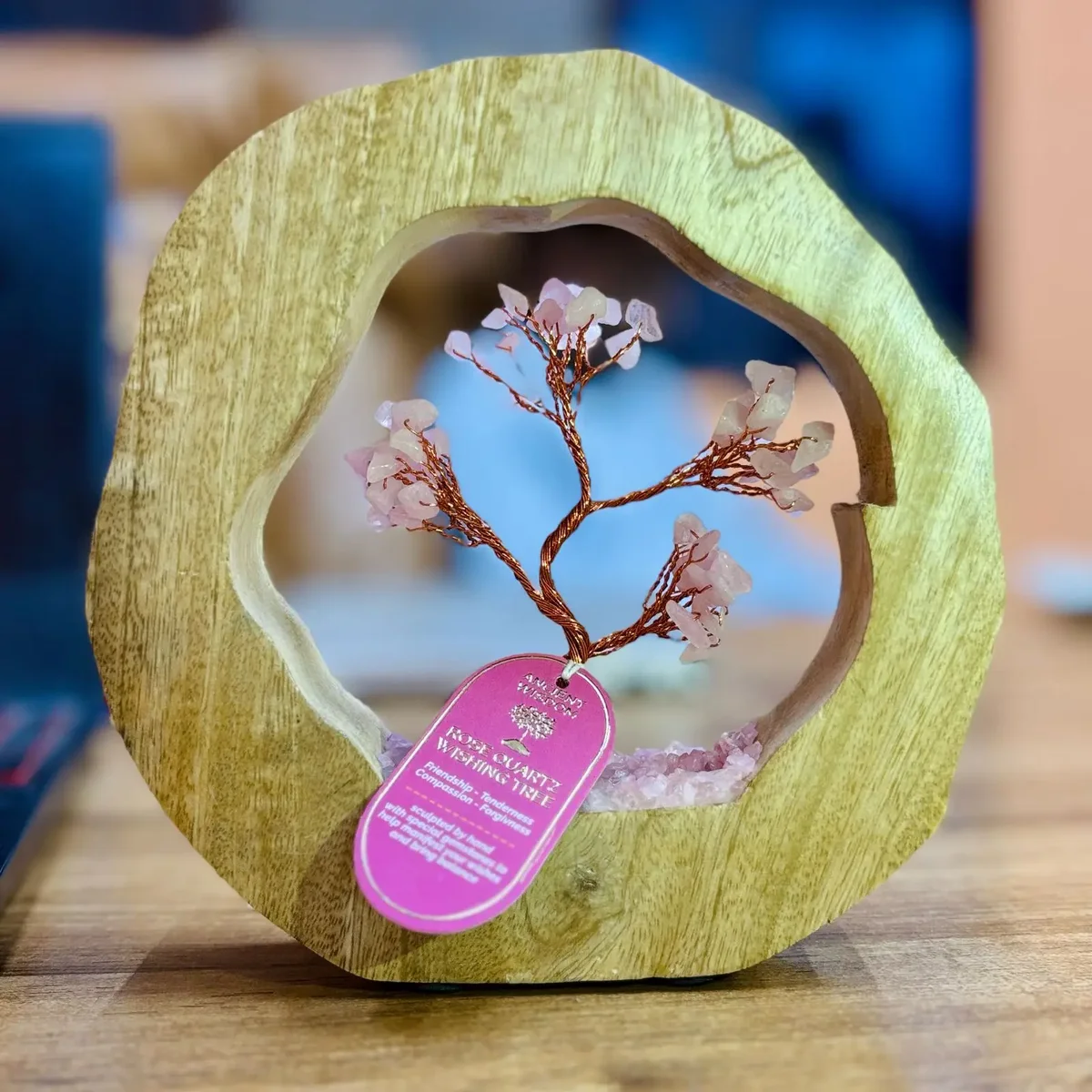 Mango wood gemstone tree with rose quartz chipstones arranged in a decorative ring base, 60 stones visible