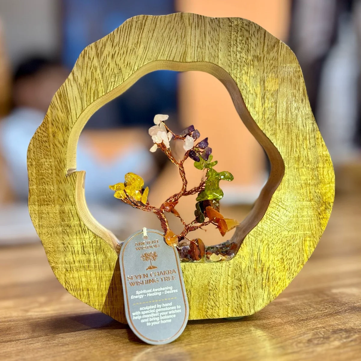 Seven chakra gemstone tree with 60 chipstones on a mango wood ring base for home decor or meditation