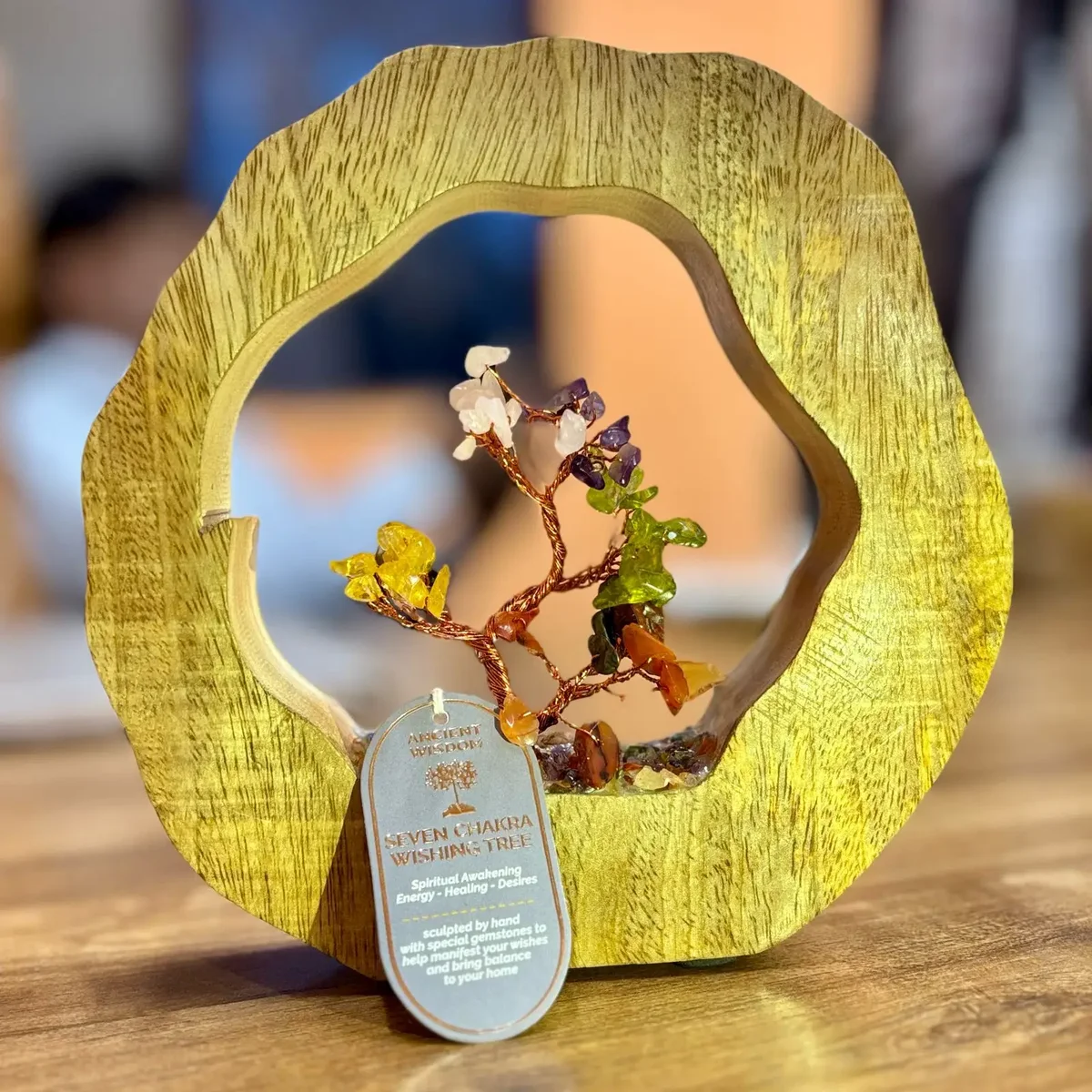 Seven chakra gemstone tree with 60 chipstones on a mango wood ring ornament base