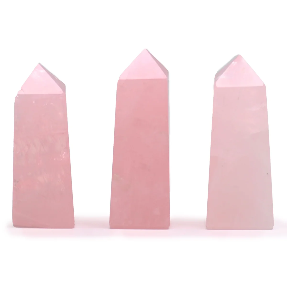 Rose quartz obelisk gemstone point approximately 5cm tall with smooth polished surface on white background