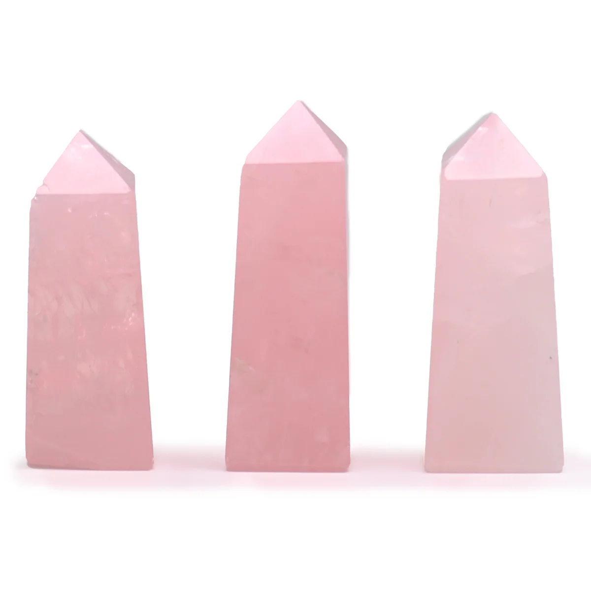Polished 5cm rose quartz decor obelisk point with smooth surfaces and soft pink hue on white background