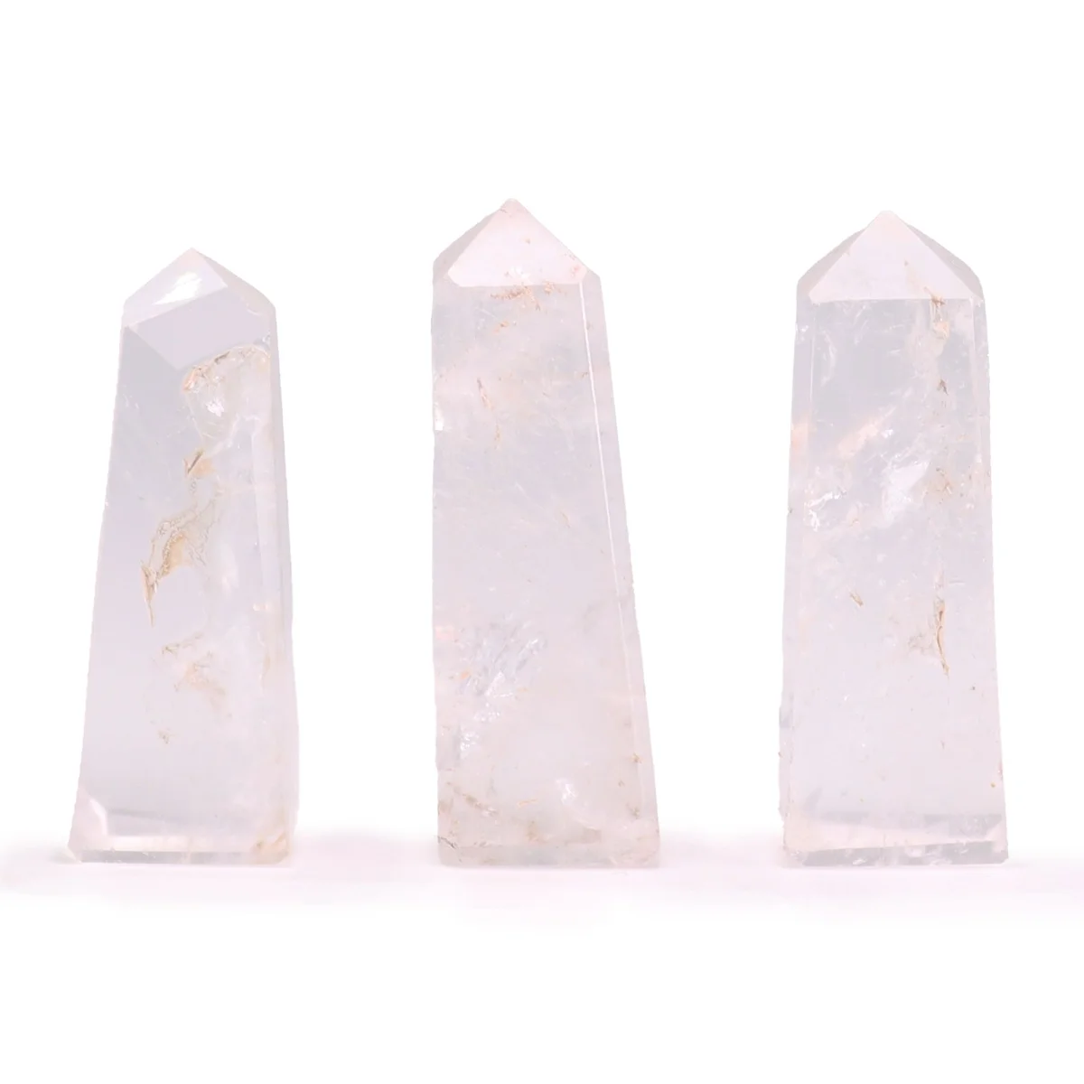 Clear quartz obelisk gemstone point approximately 5cm tall with smooth polished surfaces and pointed tip