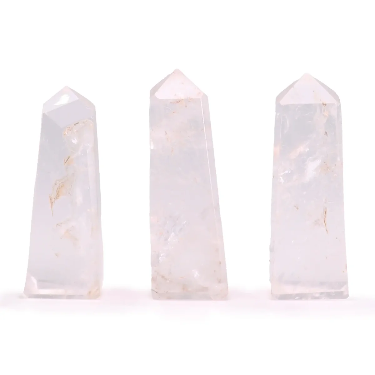 Clear quartz gemstone obelisk point approximately 5cm tall with smooth polished surfaces and pointed tip