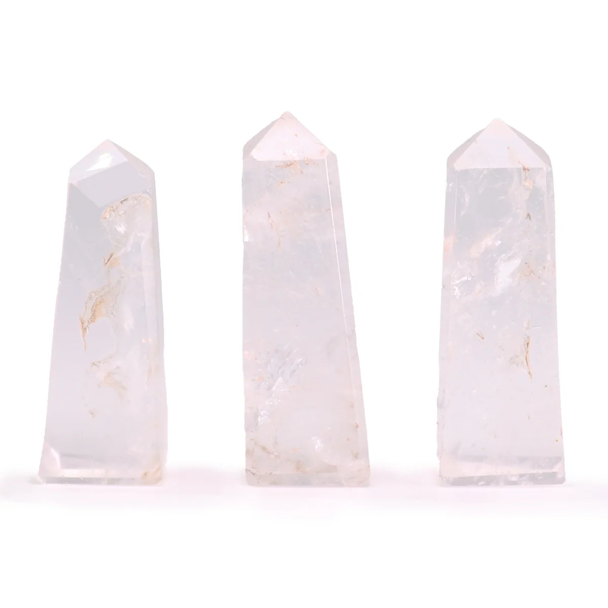 Clear Quartz 5cm crystal obelisk point with smooth polished surfaces and pointed tip on white background