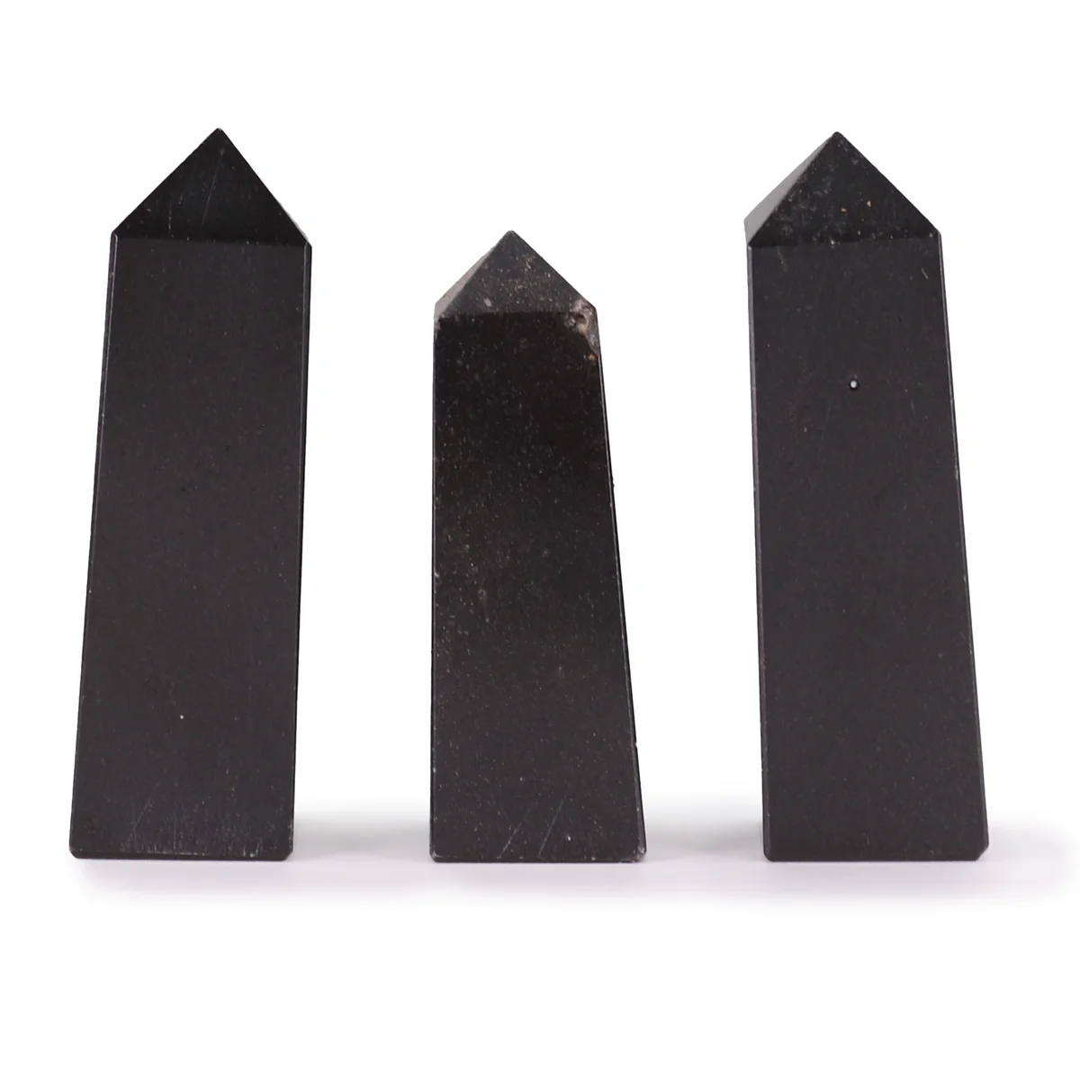 Tourmaline 5cm gemstone obelisk point with polished surface and natural color variations on white background