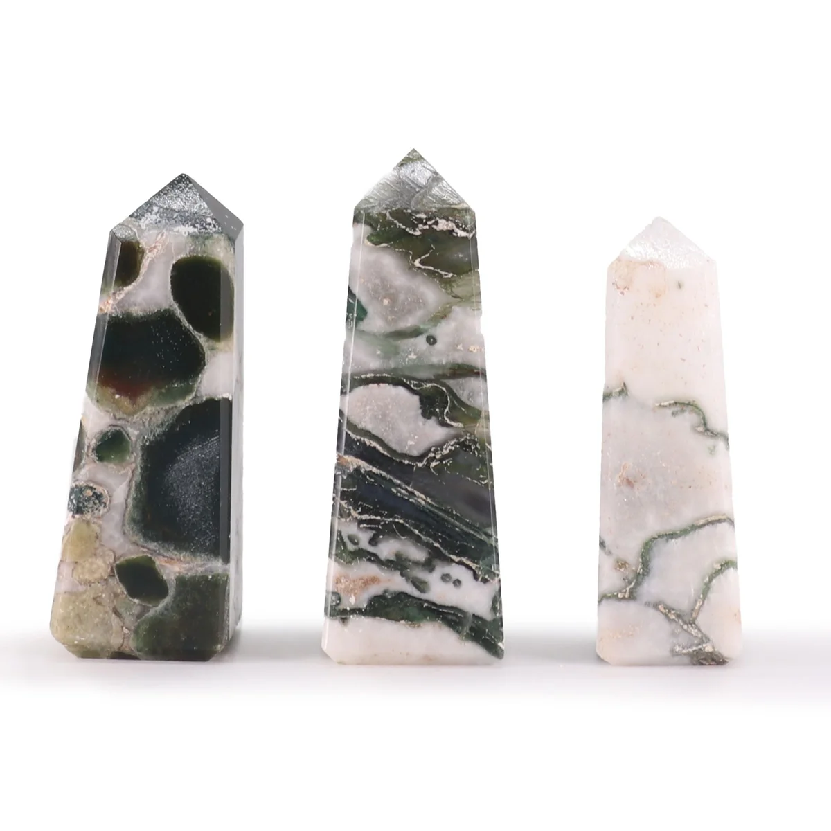 Small moss agate obelisk gemstone point approximately 5cm tall with green and white natural patterns