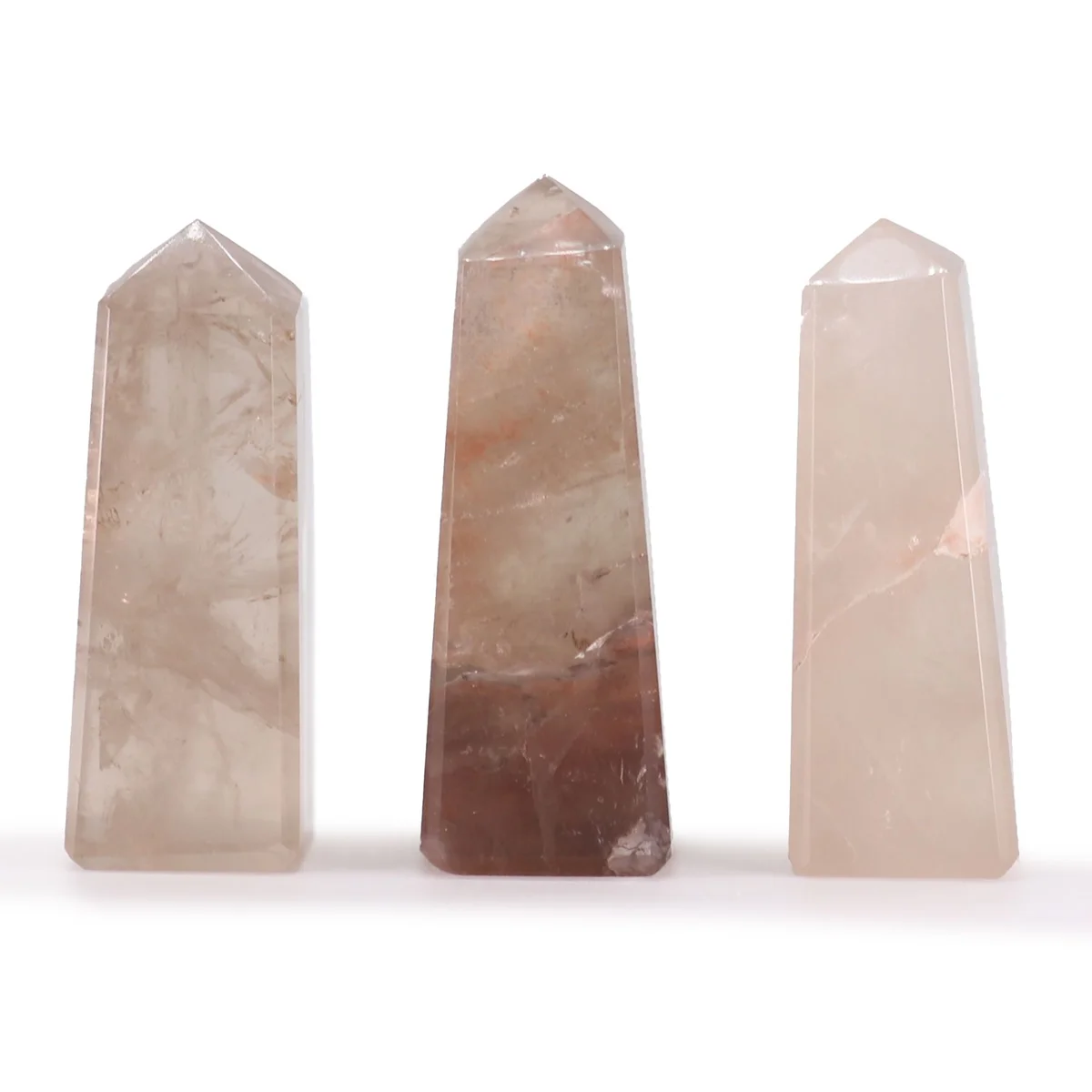 Small smokey quartz obelisk gemstone point approximately 5cm tall on a white background