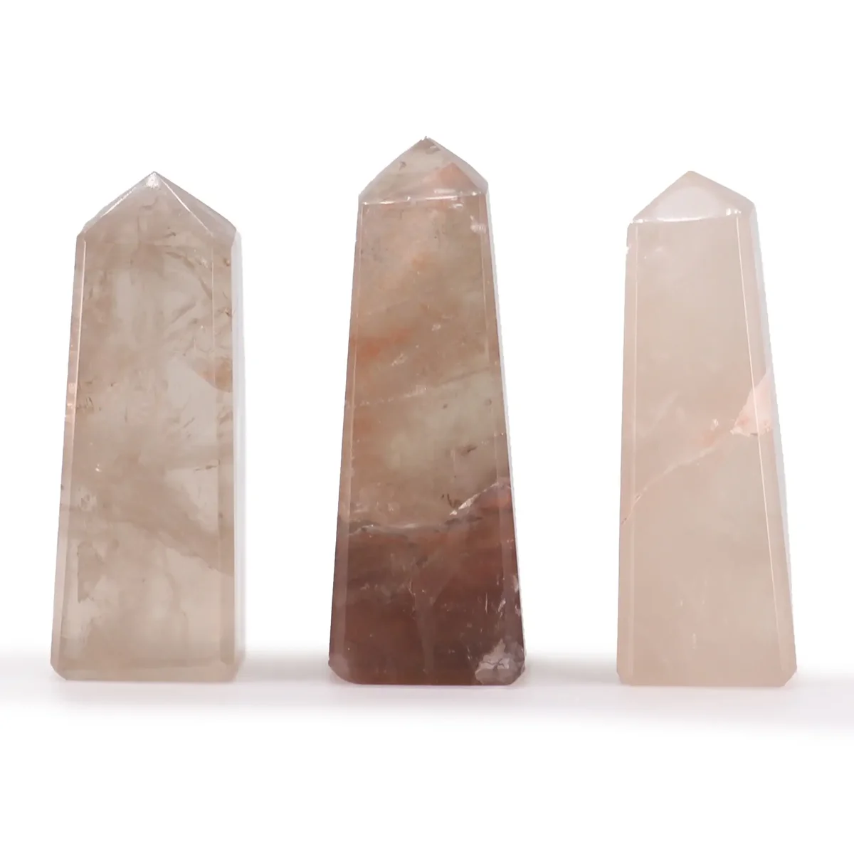 Smokey Quartz gemstone obelisk point approximately 5cm tall with smooth polished surfaces on white background