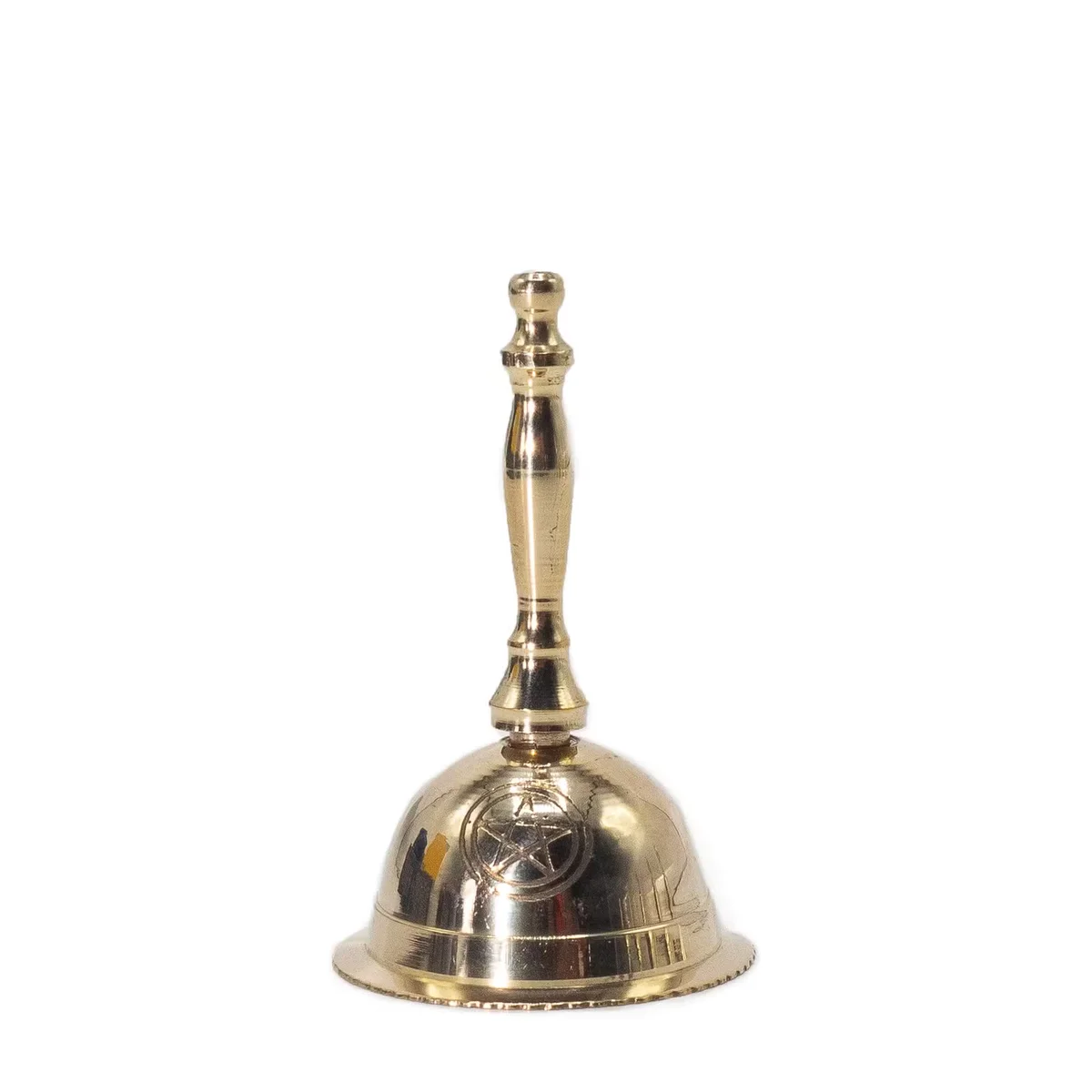 Small decorative brass altar bell with penta moon design, shown on plain white background, side view