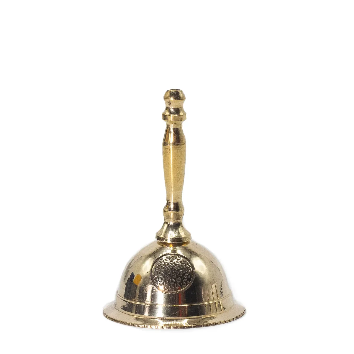 Small brass altar bell engraved with the flower of life design, used for spiritual or meditation practices