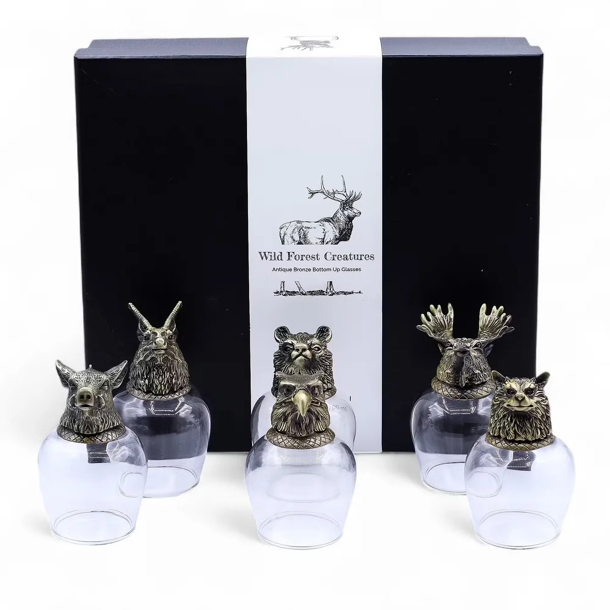 Set of six 100ml glasses with antique bronze wild forest creatures design displayed on a wooden surface