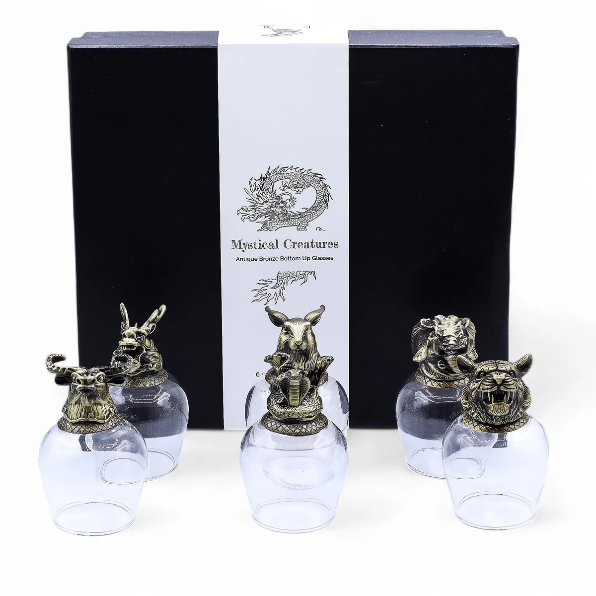 Set of six 100ml antique bronze glasses featuring mystical creature designs arranged on a wooden surface