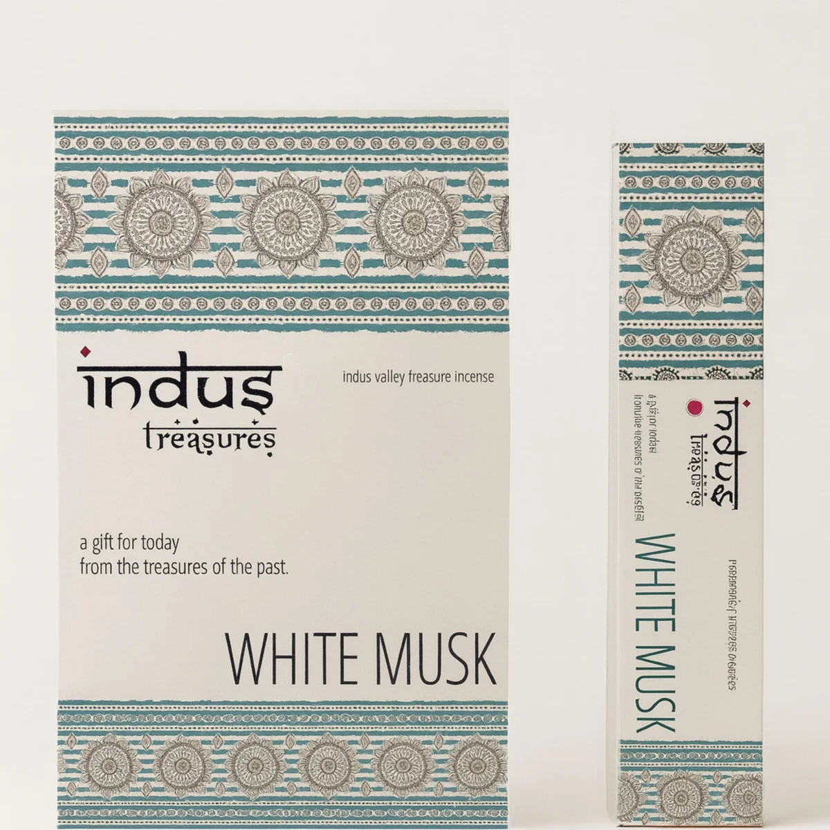 Clear glass bottle of 15gms white musk essential oil with Indus Treasures label.