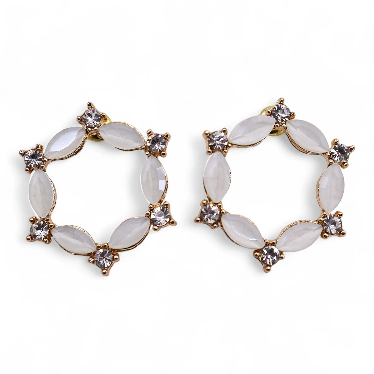 Pair of pearl vintage glass earrings with loop design on white background