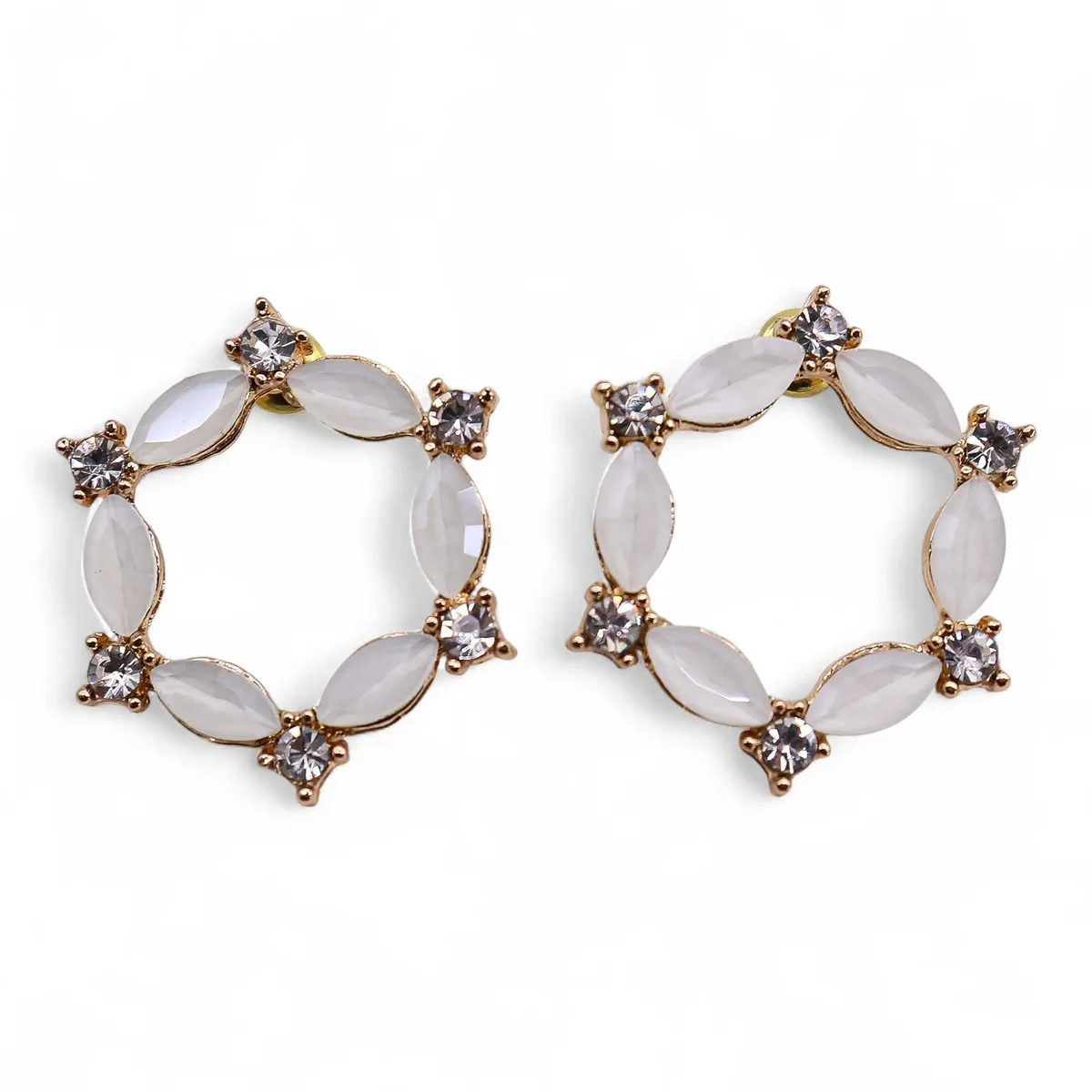 Vintage glass pearl loop earrings with a smooth, rounded design and subtle shine on a white background