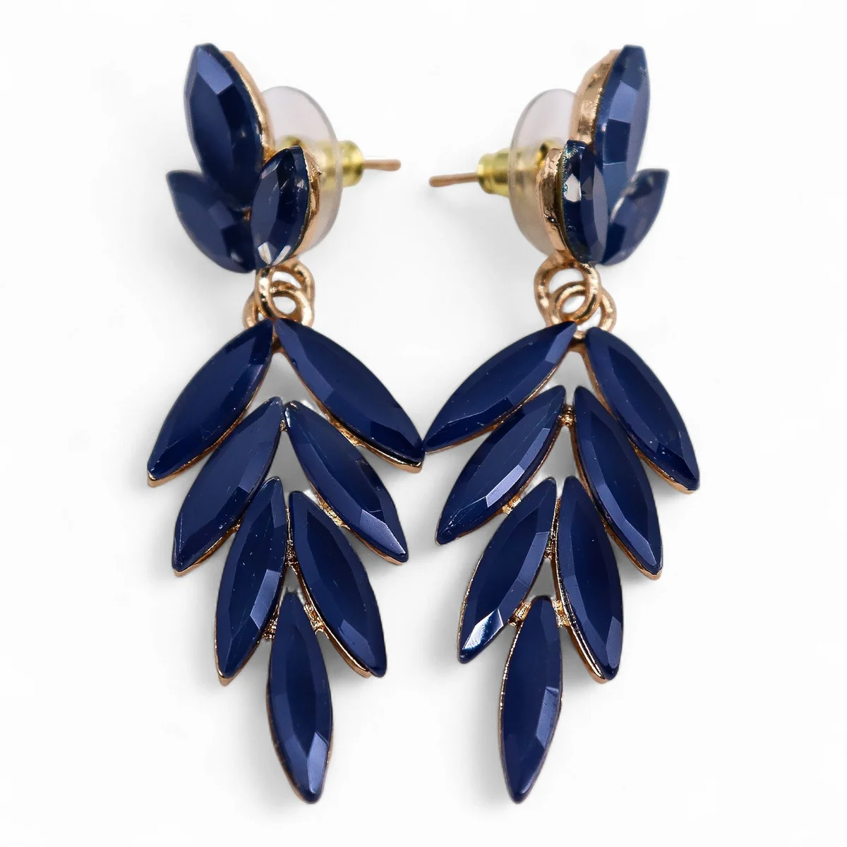 Pair of royal blue earrings with vintage glass long drop design hanging against white background