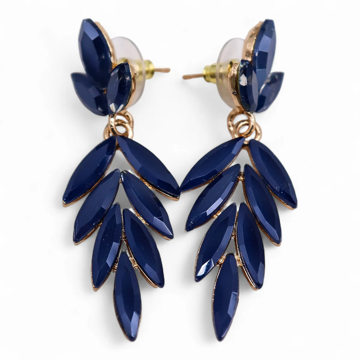 Royal blue vintage glass long drop earrings hanging against a white background, showing their length and color details