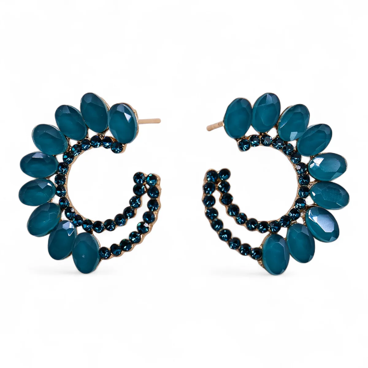 Pair of teal green vintage glass loop earrings displayed against a white background