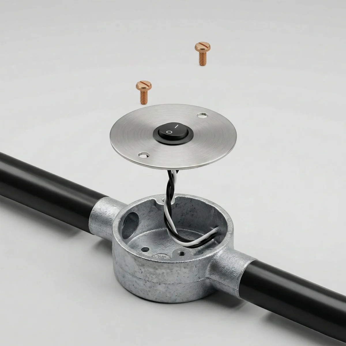 Round black metal cover plate switch with pre-wired rocker switch and mounting screws for junction box panel mount