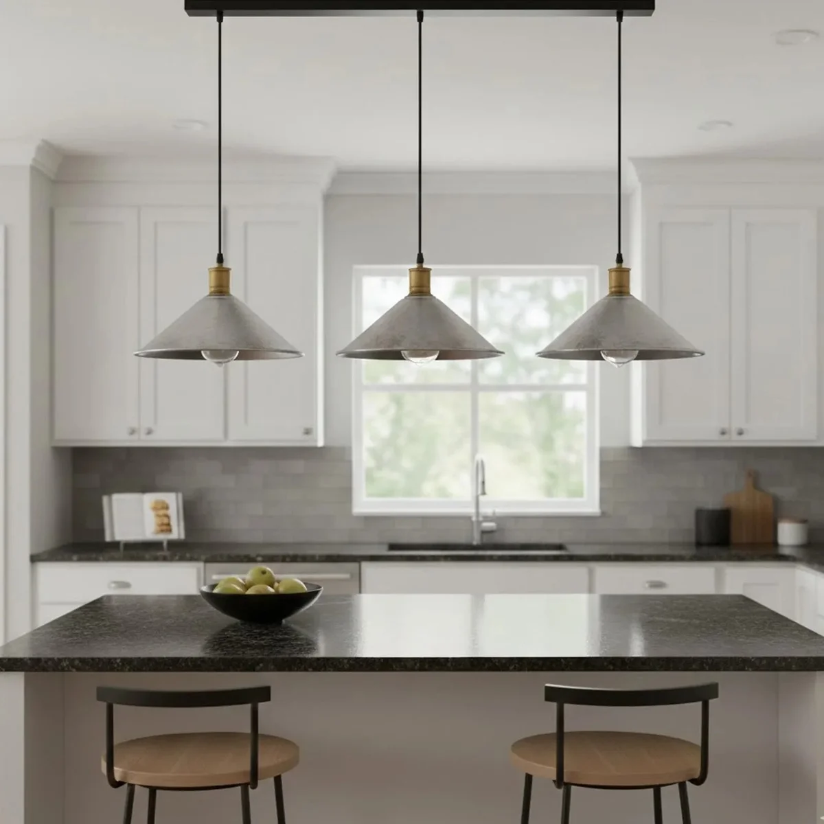 Three-head vintage pendant light with metal shades hanging above kitchen counter in industrial style setting