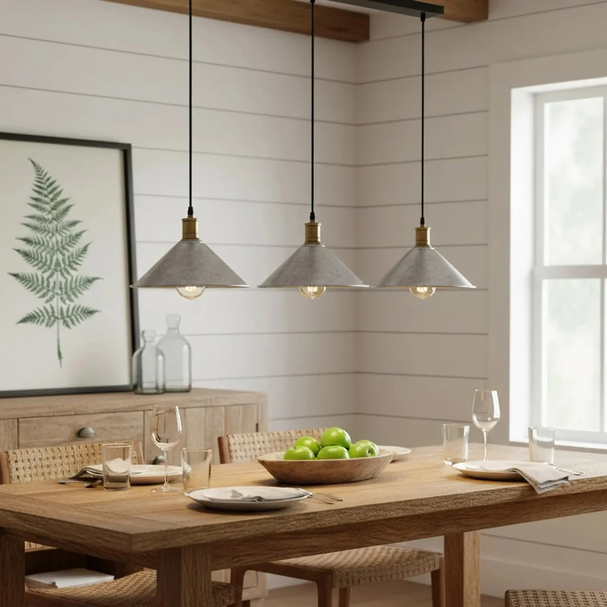 Three-head drop down pendant lamp with metal shades in industrial style lighting above a kitchen counter