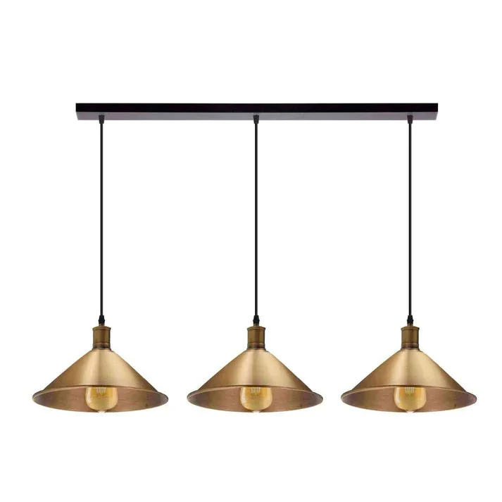 Three-head vintage pendant light with adjustable metal shades hanging above a kitchen counter in industrial style