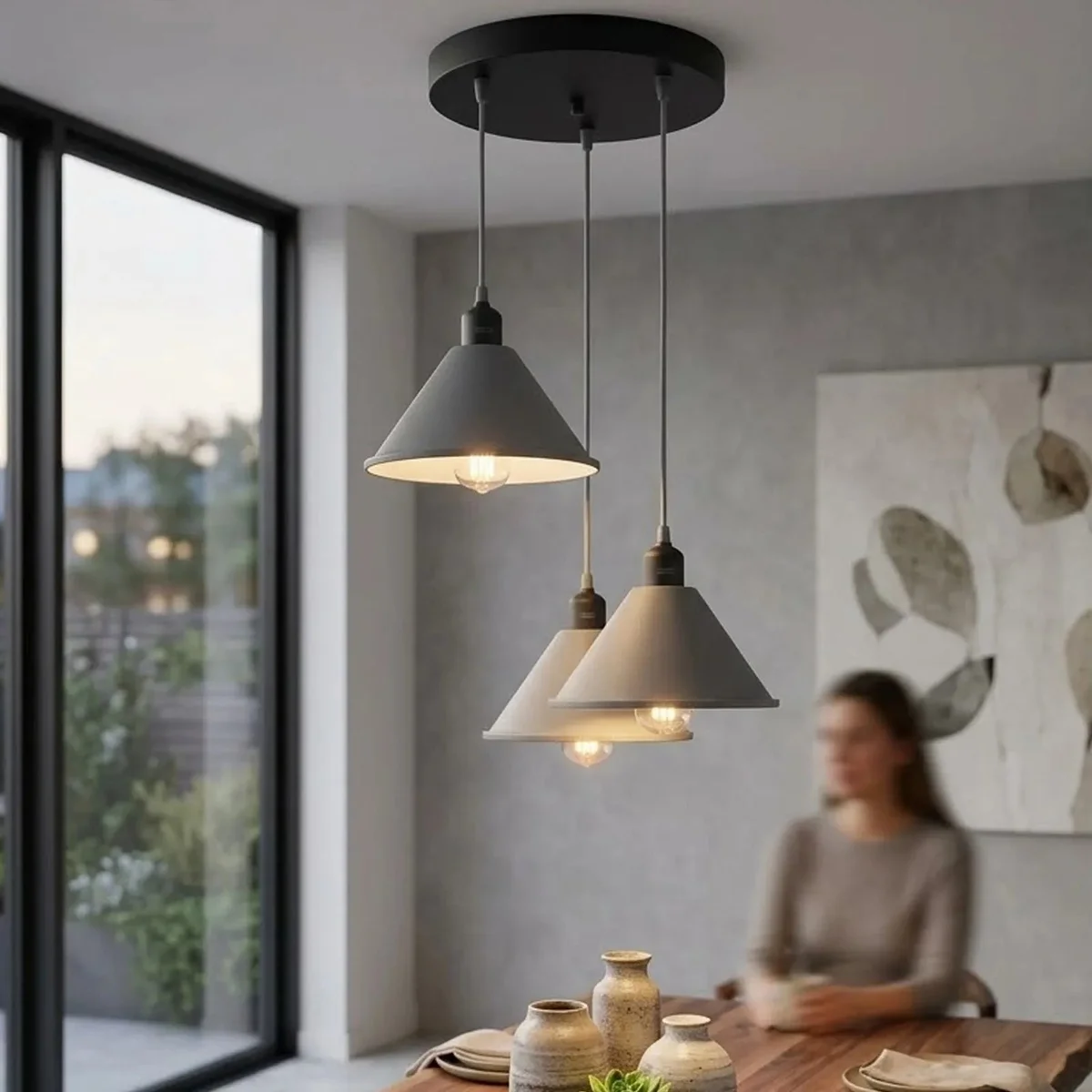 Adjustable pendant light with three retro metal cone shades and warm LED bulbs hanging from a compact ceiling rose