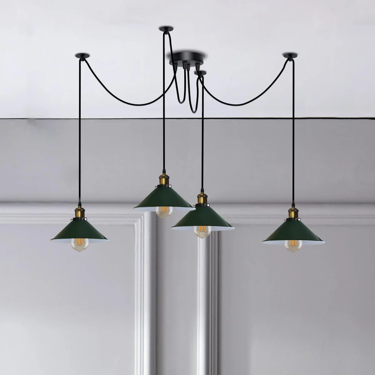 Modern 4 arm swag ceiling light with adjustable metal arms and cone shades hanging over a dining table with long cables