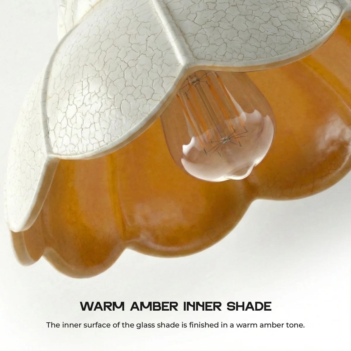 Clear scalloped vintage crackle glass kitchen island pendant light with adjustable brass cable hanging over wooden table