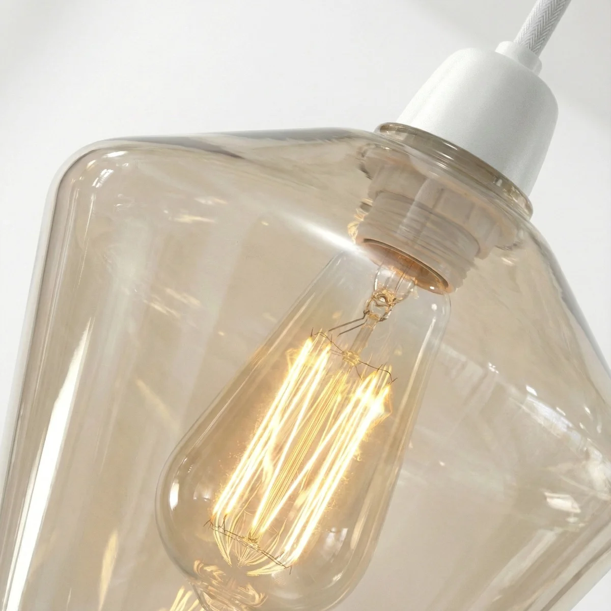 Diamond-shaped amber glass pendant shade shown from side with smooth edges, highlighting easy fit glass lampshade design