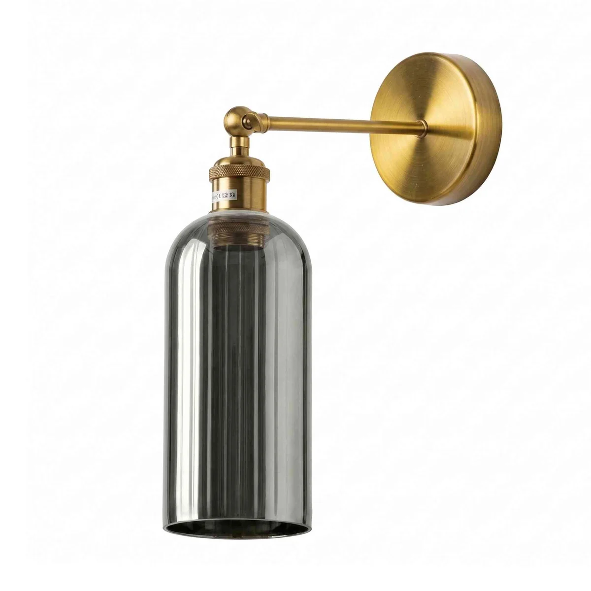 Adjustable vintage brass industrial wall light with smoked grey glass shade and 180° swing arm mounted on wall