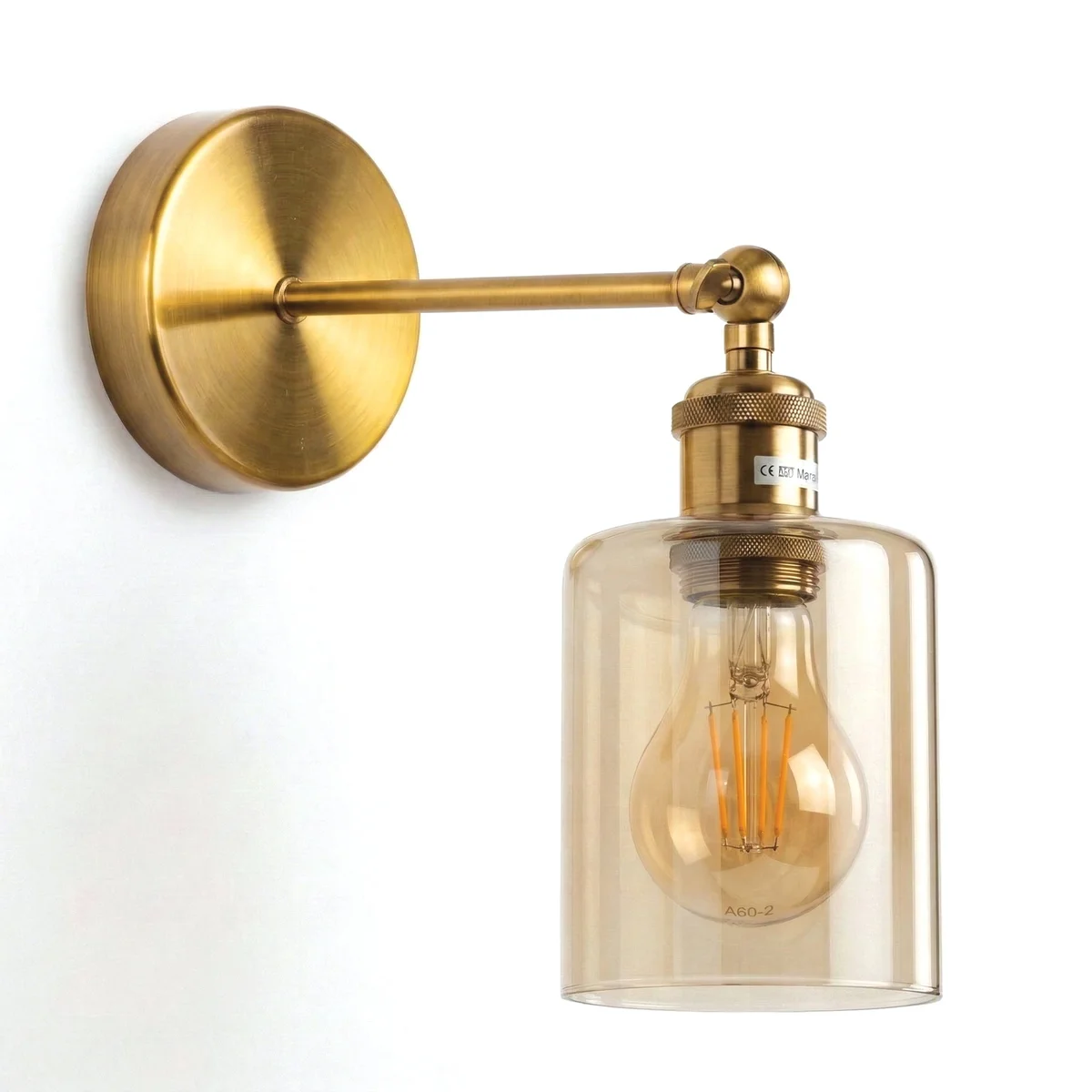 Dimmable vintage wall lamp with brass-plated adjustable arm and amber glass cylinder shade mounted on wall