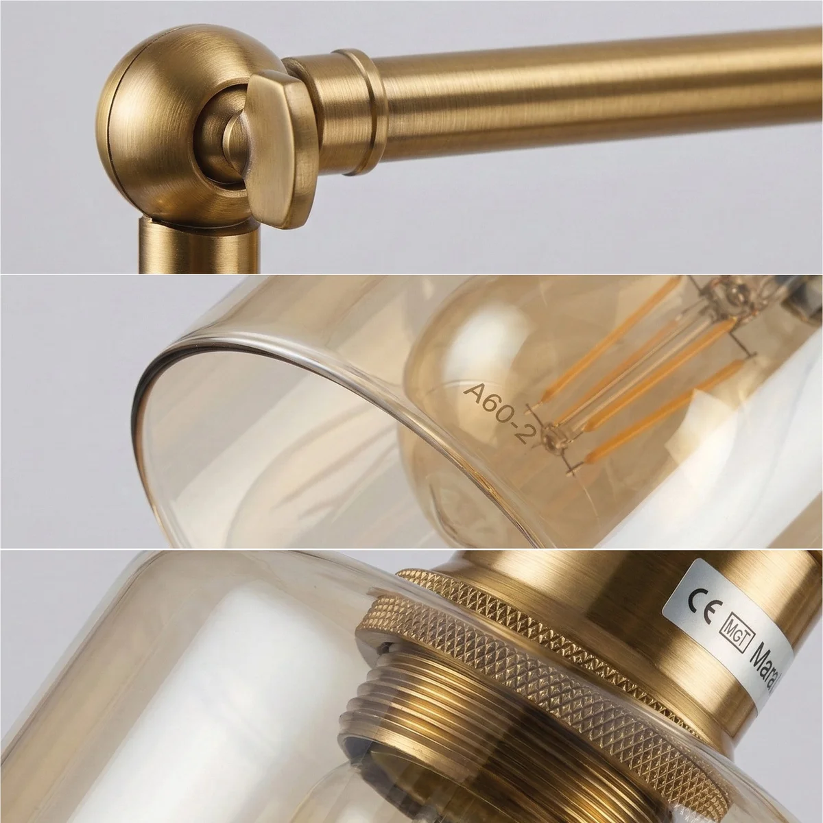 Vintage brass wall sconce with adjustable swing arm and amber glass cylinder shade mounted on wall in modern interior