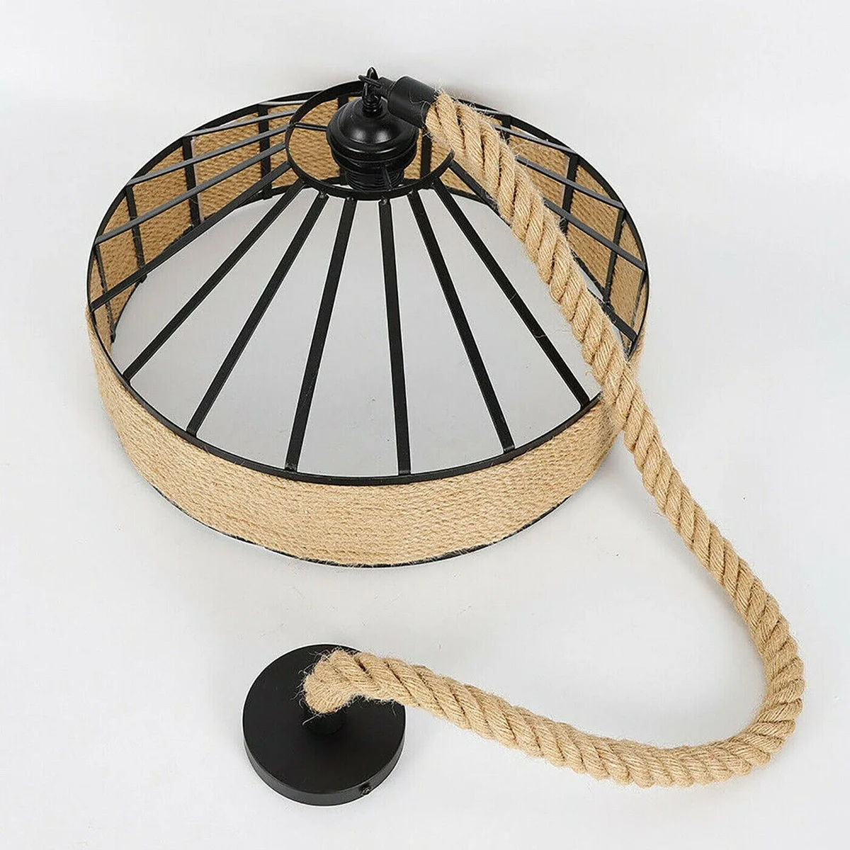 Large hemp rope pendant light with metal cage hanging in rustic café setting, showing textured hemp rope and black metal frame