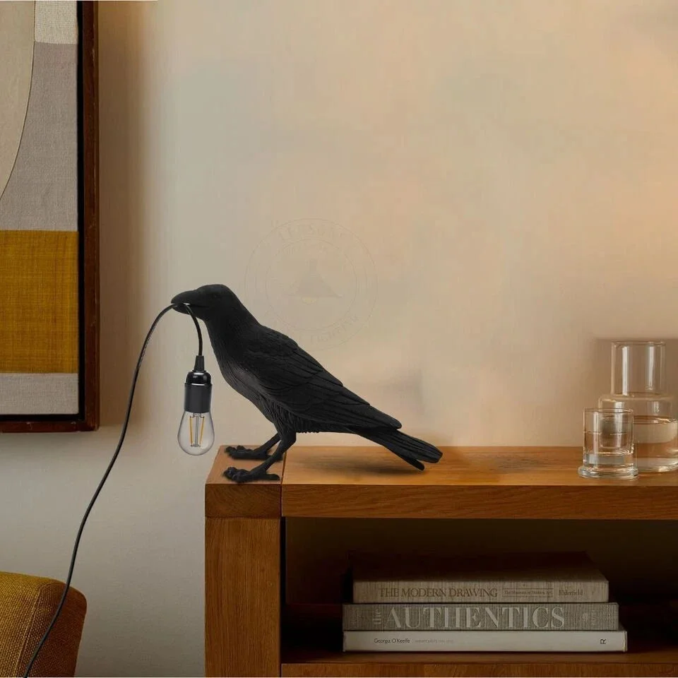 Black resin crow table lamp with E27 bulb, modern bird-shaped design, suitable for desktop or wall mounting