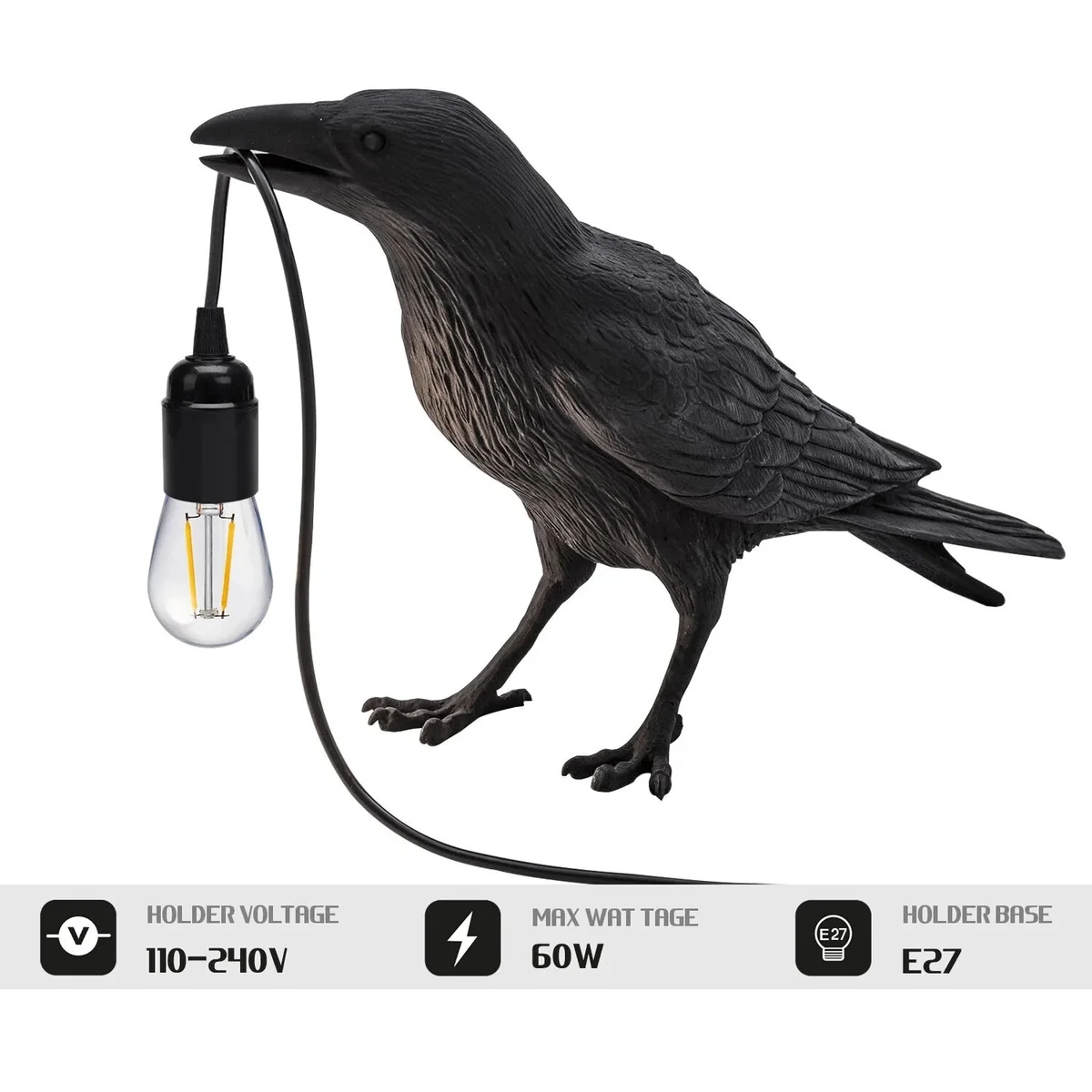 Black resin crow-shaped indoor table lamp with E27 bulb on a wooden surface against a white background