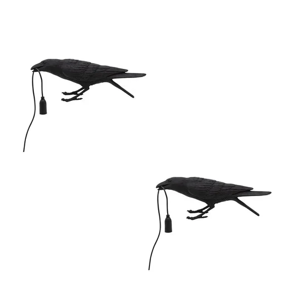 Black resin crow table lamp with E27 bulb, modern bird-shaped design, shown on a wooden surface indoors